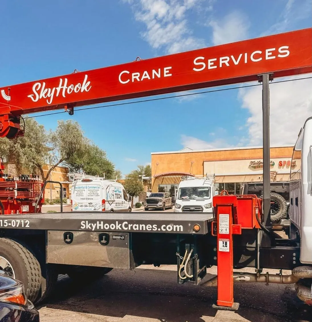 Skyhook Crane Services boom truck set up in a Phoenix-area parking lot